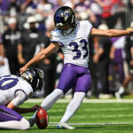 Aug 22, 2026; Minneapolis, Minnesota, USA; Baltimore Ravens place kicker Tyler Loop (33) kicks a field goal as punter Ryan Eckley (30) holds during the third quarter against the Minnesota Vikings at U.S. Bank Stadium. Mandatory Credit: Jeffrey Becker-Imagn Images
