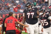 Aug 20, 2026; Houston, Texas, USA; Houston Texans offensive tackle Trent Brown (77) and teammates enters the field out of the tunnel before the Texans play the Las Vegas Raiders at Reliant Stadium. Mandatory Credit: Thomas Shea-Imagn Images
