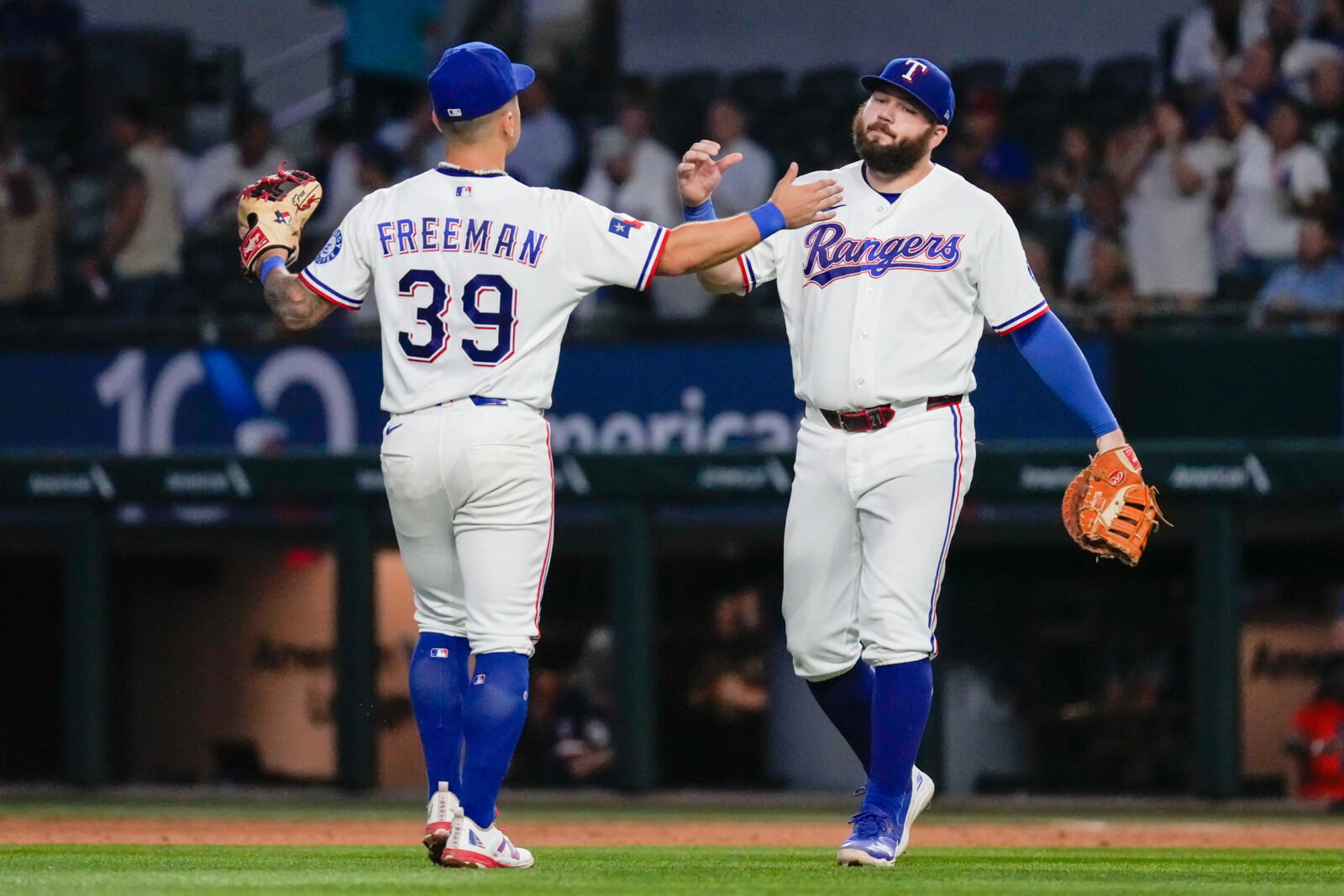 Aug 31, 2026; Arlington, Texas, USA; Texas Rangers third baseman Cody Freeman (39) and first baseman Jake Burger (21) react after defeating the Athletics at Globe Life Field. Mandatory Credit: Raymond Carlin III-Imagn Images