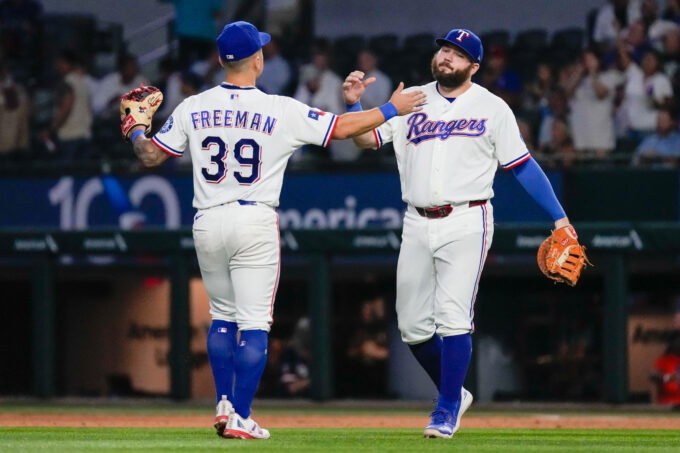 Aug 31, 2026; Arlington, Texas, USA; Texas Rangers third baseman Cody Freeman (39) and first baseman Jake Burger (21) react after defeating the Athletics at Globe Life Field. Mandatory Credit: Raymond Carlin III-Imagn Images