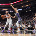Nov 15, 2022; Sacramento, California, USA; Brooklyn Nets guard Ben Simmons (10) spins towards the hoop next to Sacramento Kings forward Domantas Sabonis (10) in the second quarter at the Golden 1 Center. Mandatory Credit: Cary Edmondson-USA TODAY Sports