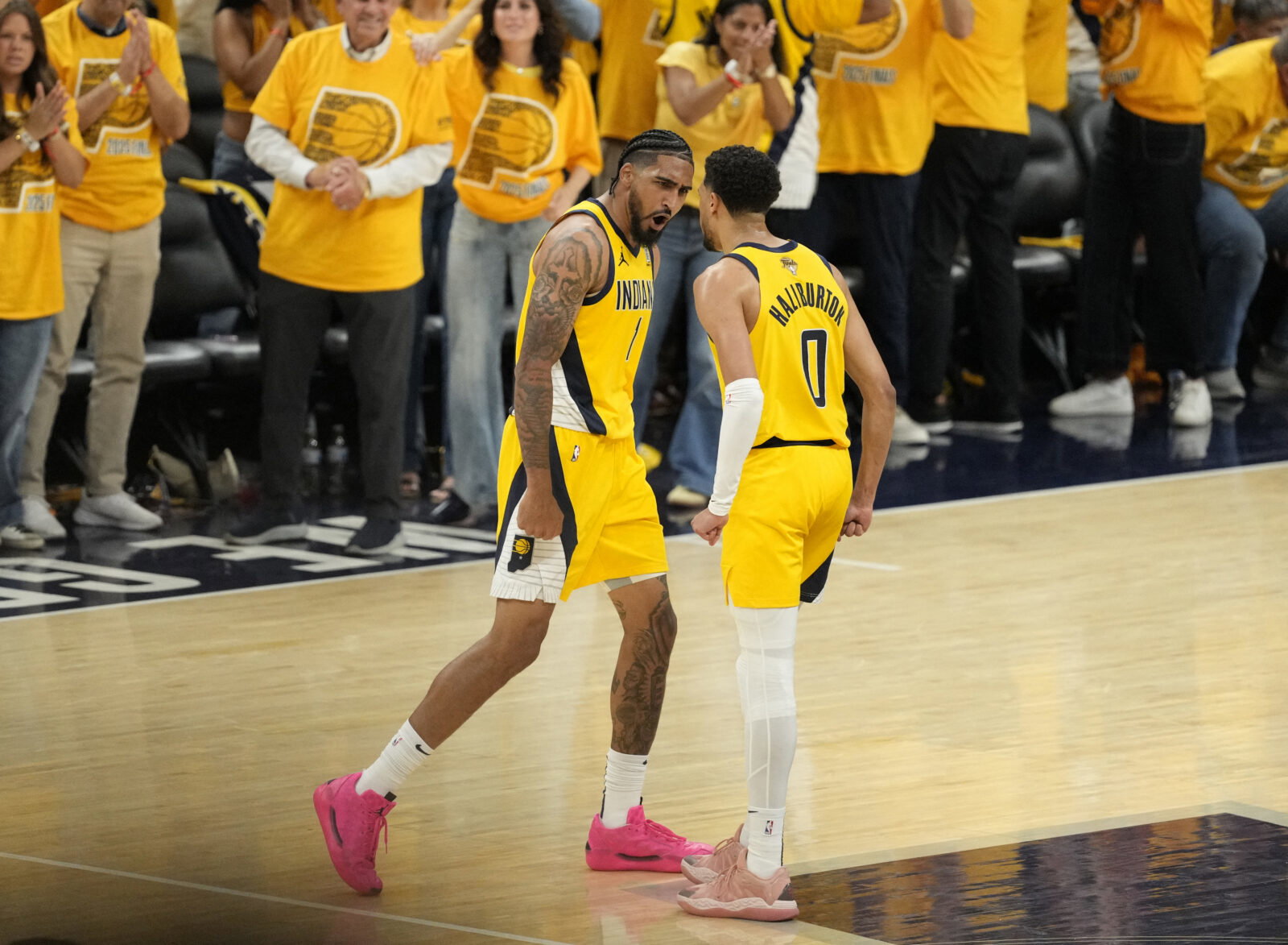 Jun 13, 2025; Indianapolis, Indiana, USA; Indiana Pacers forward Obi Toppin (1) and guard Tyrese Haliburton (0) react after ToppinÕs three point basket against the Oklahoma City Thunder during the third quarter of game four of the 2025 NBA Finals at Gainbridge Fieldhouse. Mandatory Credit: Kyle Terada-Imagn Images