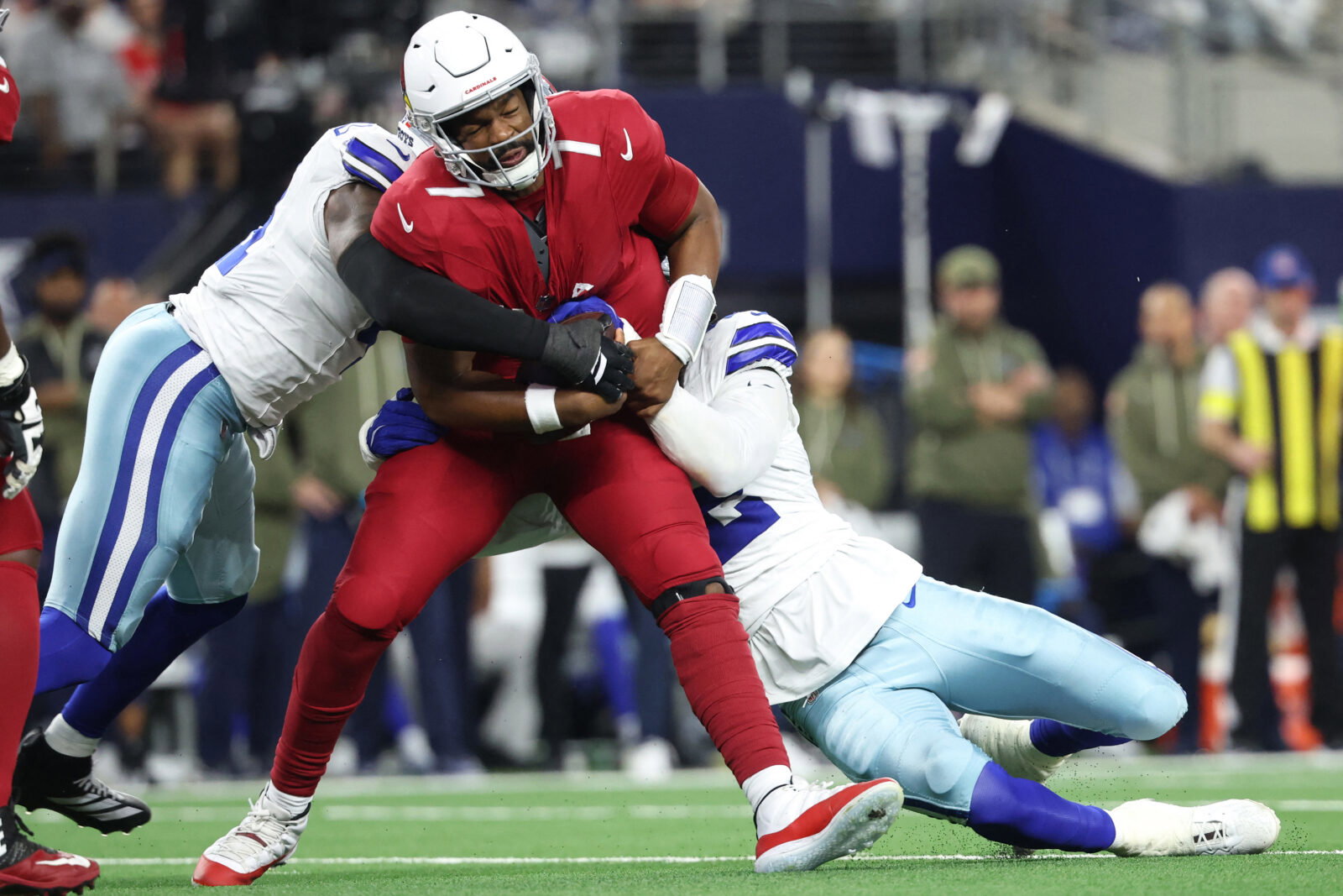 Nov 3, 2025; Arlington, Texas, USA; Dallas Cowboys defensive end Jadeveon Clowney (42) and defensive end Donovan Ezeiruaku (41) sack Arizona Cardinals quarterback Jacoby Brissett (7) in the first half at AT&T Stadium. Mandatory Credit: Kevin Jairaj-Imagn Images
