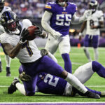 Nov 9, 2025; Minneapolis, Minnesota, USA; Baltimore Ravens wide receiver Rashod Bateman (7) is tackled by Minnesota Vikings cornerback Isaiah Rodgers (2) during the fourth quarter at U.S. Bank Stadium. Mandatory Credit: Jeffrey Becker-Imagn Images