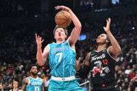 Nov 17, 2025; Toronto, Ontario, CAN; Charlotte Hornets forward Kon Kneuppel (7) blocks a pass intended for Toronto Raptors forward Collin Murray-Boyles (12) in the first half at Scotiabank Arena. Mandatory Credit: Dan Hamilton-Imagn Images