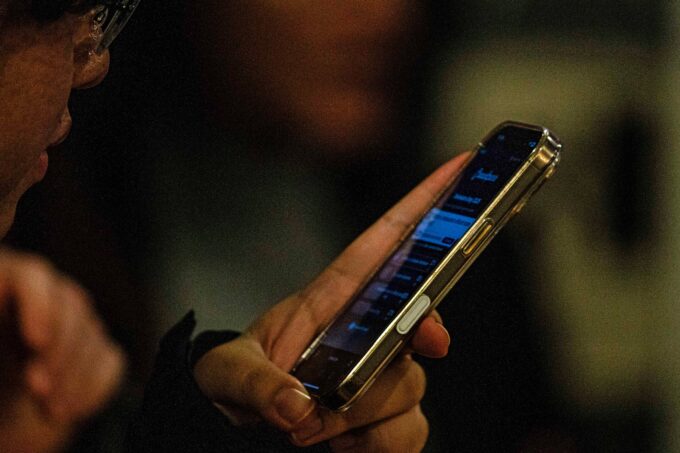 person playing game on their phone