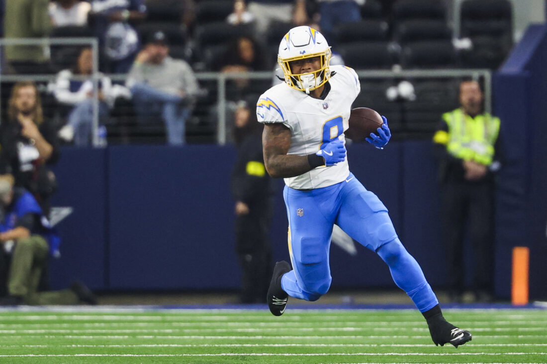 Dec 21, 2025; Arlington, Texas, USA; Los Angeles Chargers running back Omarion Hampton (8) rushes against the Dallas Cowboys during the second quarter at AT&T Stadium. Mandatory Credit: Kevin Jairaj-Imagn Images