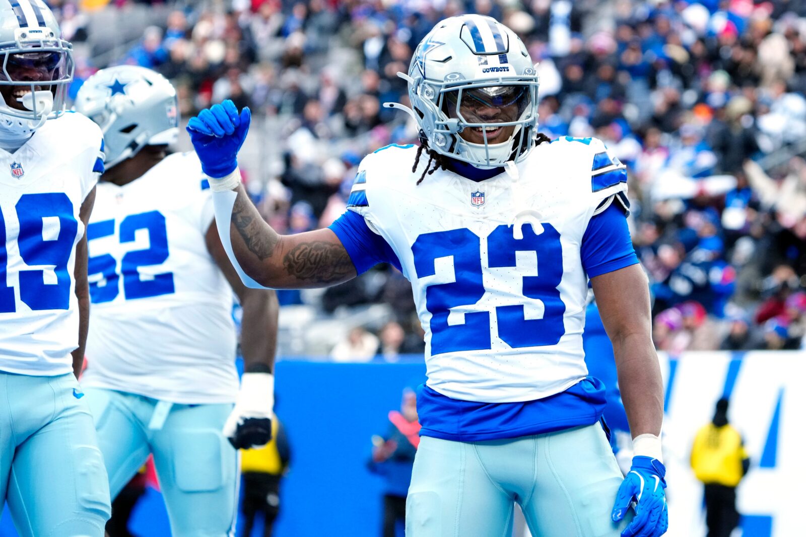 Dallas Cowboys running back Jaydon Blue (23) celebrates after scoring the first touchdown of the game, Sunday, January 4, 2026, in East Rutherford.