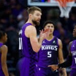 Jan 16, 2026; Sacramento, California, USA; Sacramento Kings forward Domantas Sabonis (11) talks with guard Dennis Schroder (17) during the second quarter against the Washington Wizards at Golden 1 Center. Mandatory Credit: Sergio Estrada-Imagn Images