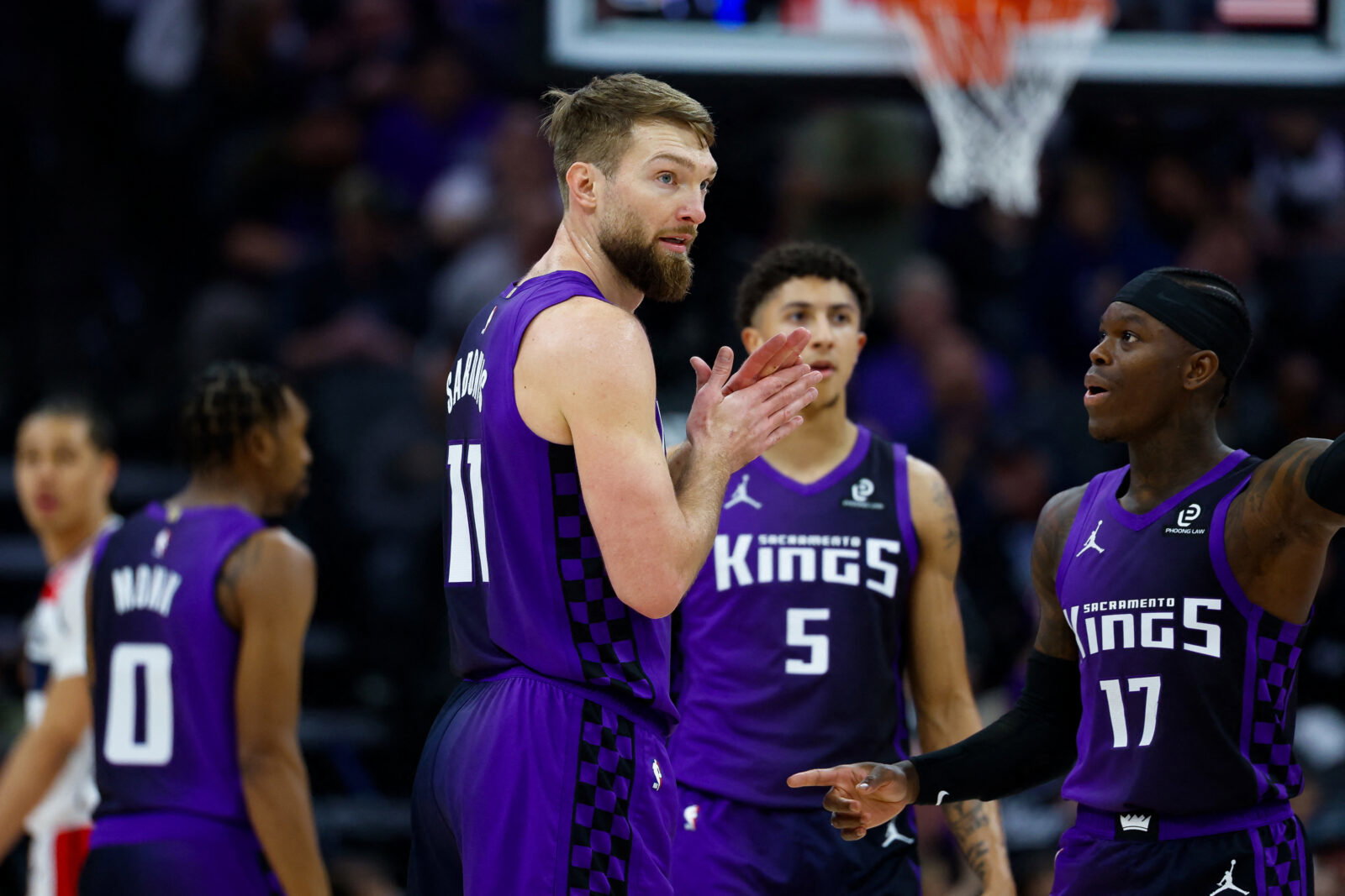 Jan 16, 2026; Sacramento, California, USA; Sacramento Kings forward Domantas Sabonis (11) talks with guard Dennis Schroder (17) during the second quarter against the Washington Wizards at Golden 1 Center. Mandatory Credit: Sergio Estrada-Imagn Images