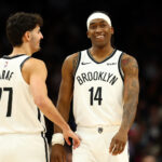 Jan 27, 2026; Phoenix, Arizona, USA; Brooklyn Nets guard Ben Saraf (77) and guard Terance Mann (14) against the Phoenix Suns at Mortgage Matchup Center. Mandatory Credit: Mark J. Rebilas-Imagn Images