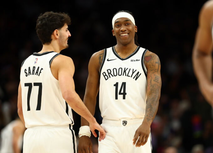 Jan 27, 2026; Phoenix, Arizona, USA; Brooklyn Nets guard Ben Saraf (77) and guard Terance Mann (14) against the Phoenix Suns at Mortgage Matchup Center. Mandatory Credit: Mark J. Rebilas-Imagn Images