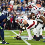 Feb 8, 2026; Santa Clara, CA, USA;General view down the line of scrimmage as New England Patriots center Garrett Bradbury (65) prepares to snap the ball against the Seattle Seahawks during Super Bowl LX at Levi's Stadium. Mandatory Credit: Mark J. Rebilas-Imagn Images
