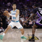 Mar 11, 2026; Sacramento, California, USA; Charlotte Hornets guard Josh Green (10) looks to pass the ball against Sacramento Kings forward/guard Daeqwon Plowden (29) during the third quarter at Golden 1 Center. Mandatory Credit: Kelley L Cox-Imagn Images