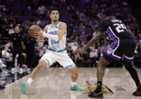 Mar 11, 2026; Sacramento, California, USA; Charlotte Hornets guard Josh Green (10) looks to pass the ball against Sacramento Kings forward/guard Daeqwon Plowden (29) during the third quarter at Golden 1 Center. Mandatory Credit: Kelley L Cox-Imagn Images