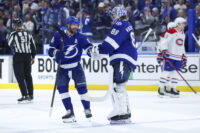 Apr 21, 2026; Tampa, Florida, USA; Tampa Bay Lightning right wing Nikita Kucherov (86) and goaltender Andrei Vasilevskiy (88) react after beating the Montreal Canadiens in overtime during game two of the first round of the 2026 Stanley Cup Playoffs at Benchmark International Arena. Mandatory Credit: Nathan Ray Seebeck-Imagn Images