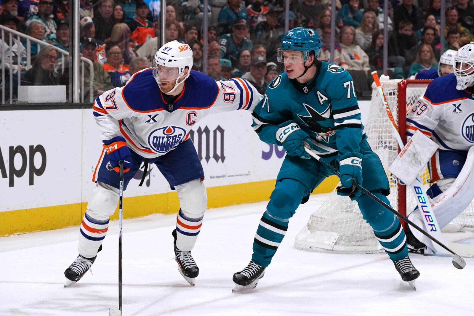 Apr 8, 2026; San Jose, California, USA; Edmonton Oilers center Connor McDavid (97) and San Jose Sharks center Macklin Celebrini (71) wait for the puck during the second period at SAP Center at San Jose. Mandatory Credit: David Gonzales-Imagn Images