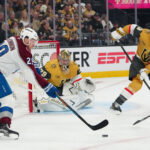 May 24, 2026; Las Vegas, Nevada, USA; Vegas Golden Knights goaltender Carter Hart (79) and defenseman Brayden McNabb (3) defend against Colorado Avalanche center Nathan MacKinnon (29) during the second period in game three of the Western Conference Final of the 2026 Stanley Cup Playoffs at T-Mobile Arena. Mandatory Credit: Stephen R. Sylvanie-Imagn Images