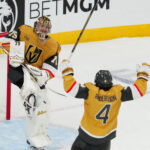 May 26, 2026; Las Vegas, Nevada, USA; Vegas Golden Knights goaltender Carter Hart (79) and defenseman Rasmus Andersson (4) celebrate winning the Western Conference playoffs against the Colorado Avalanche in game four of the Western Conference Final of the 2026 Stanley Cup Playoffs at T-Mobile Arena. Mandatory Credit: Stephen R. Sylvanie-Imagn Images