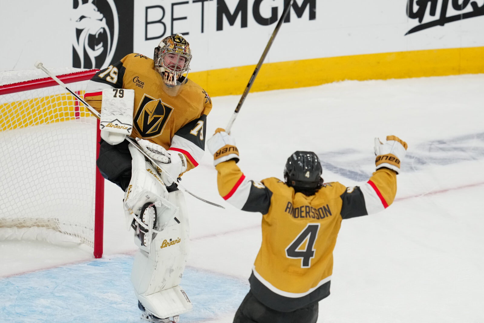 May 26, 2026; Las Vegas, Nevada, USA; Vegas Golden Knights goaltender Carter Hart (79) and defenseman Rasmus Andersson (4) celebrate winning the Western Conference playoffs against the Colorado Avalanche in game four of the Western Conference Final of the 2026 Stanley Cup Playoffs at T-Mobile Arena. Mandatory Credit: Stephen R. Sylvanie-Imagn Images