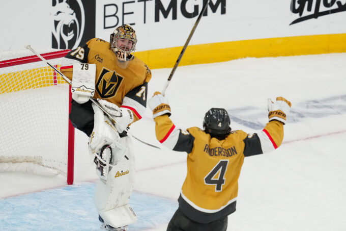 May 26, 2026; Las Vegas, Nevada, USA; Vegas Golden Knights goaltender Carter Hart (79) and defenseman Rasmus Andersson (4) celebrate winning the Western Conference playoffs against the Colorado Avalanche in game four of the Western Conference Final of the 2026 Stanley Cup Playoffs at T-Mobile Arena. Mandatory Credit: Stephen R. Sylvanie-Imagn Images