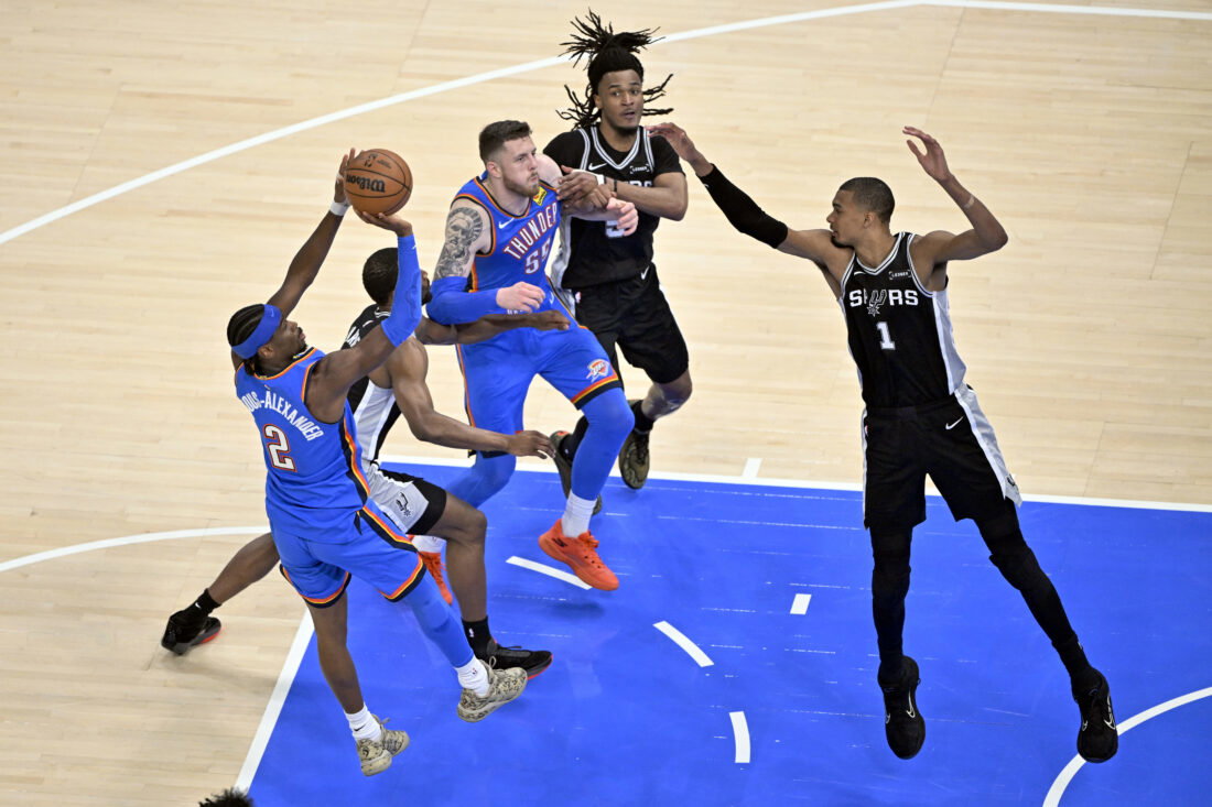 May 30, 2026; Oklahoma City, Oklahoma, USA; Oklahoma City Thunder guard Shai Gilgeous-Alexander (2) shoots against San Antonio Spurs forward Victor Wembanyama (1) in the second quarter during game seven of the western conference finals for the 2026 NBA playoffs at Paycom Center. Mandatory Credit: Jerome Miron-Imagn Images
