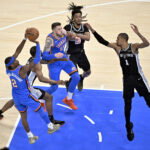 May 30, 2026; Oklahoma City, Oklahoma, USA; Oklahoma City Thunder guard Shai Gilgeous-Alexander (2) shoots against San Antonio Spurs forward Victor Wembanyama (1) in the second quarter during game seven of the western conference finals for the 2026 NBA playoffs at Paycom Center. Mandatory Credit: Jerome Miron-Imagn Images
