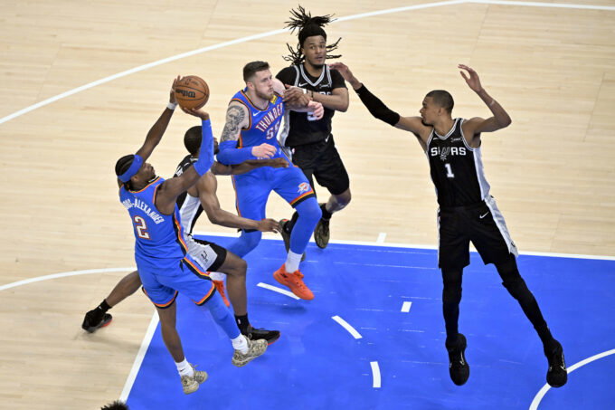 May 30, 2026; Oklahoma City, Oklahoma, USA; Oklahoma City Thunder guard Shai Gilgeous-Alexander (2) shoots against San Antonio Spurs forward Victor Wembanyama (1) in the second quarter during game seven of the western conference finals for the 2026 NBA playoffs at Paycom Center. Mandatory Credit: Jerome Miron-Imagn Images