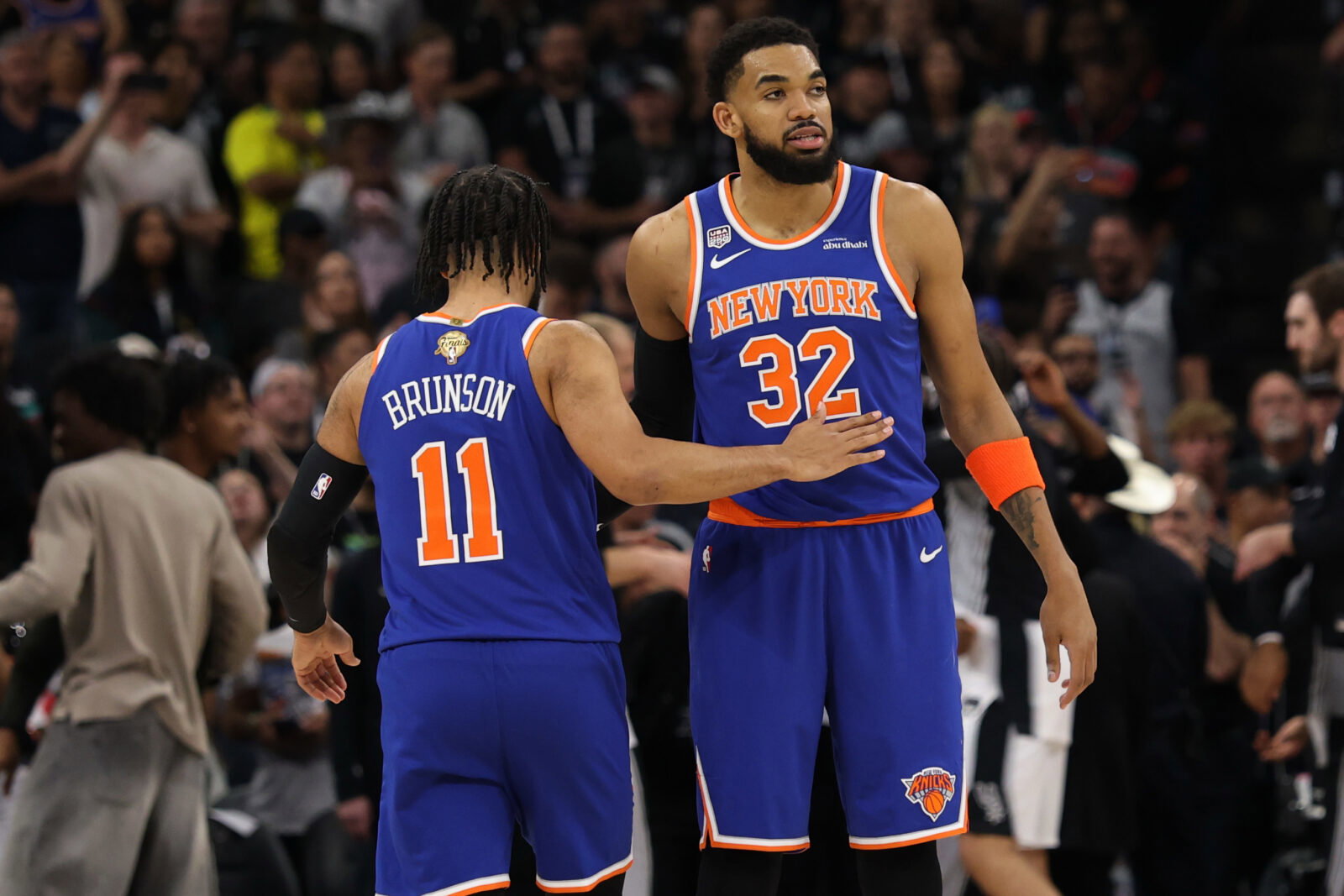 Jun 13, 2026; San Antonio, Texas, USA; New York Knicks guard Jalen Brunson (11) hugs Knicks center Karl-Anthony Towns (32) prior to the opening tip against the San Antonio Spurs in game five of the 2026 NBA Finals at Frost Bank Center. Mandatory Credit: Geoff Burke-Imagn Images