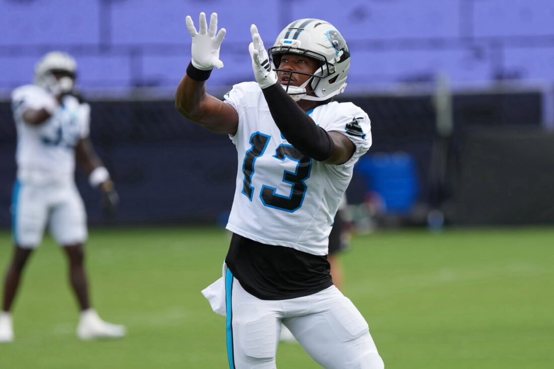 Aug 4, 2026; Charlotte, NC, USA; Carolina Panthers wide receiver John Metchie III (13) leaps for the catch during training camp at Bank of America Stadium. Mandatory Credit: Jim Dedmon-Imagn Images