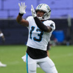 Aug 4, 2026; Charlotte, NC, USA; Carolina Panthers wide receiver John Metchie III (13) leaps for the catch during training camp at Bank of America Stadium. Mandatory Credit: Jim Dedmon-Imagn Images