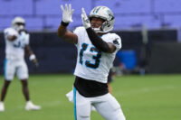 Aug 4, 2026; Charlotte, NC, USA; Carolina Panthers wide receiver John Metchie III (13) leaps for the catch during training camp at Bank of America Stadium. Mandatory Credit: Jim Dedmon-Imagn Images