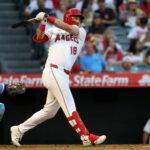 Aug 15, 2026; Anaheim, California, USA; Los Angeles Angels first baseman Nolan Schanuel (18) hits a single during the third inning against the Kansas City Royals at Angel Stadium. Mandatory Credit: Kiyoshi Mio-Imagn Images