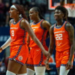 Aug 25, 2026; Uncasville, Connecticut, USA; Connecticut Sun forward Aaliyah Edwards (8), guard Saniya Rivers (22) and guard Kennedy Burke (25) react after defeating the Chicago Sky in the second half at Mohegan Sun Arena. Mandatory Credit: David Butler II-Imagn Images