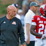 Jax State Coach Charles Kelly talks with players during college school football action at AmFirst Stadium in Jacksonville, Alabama September 5, 2026. (Dave Hyatt / Hyatt Media LLC)