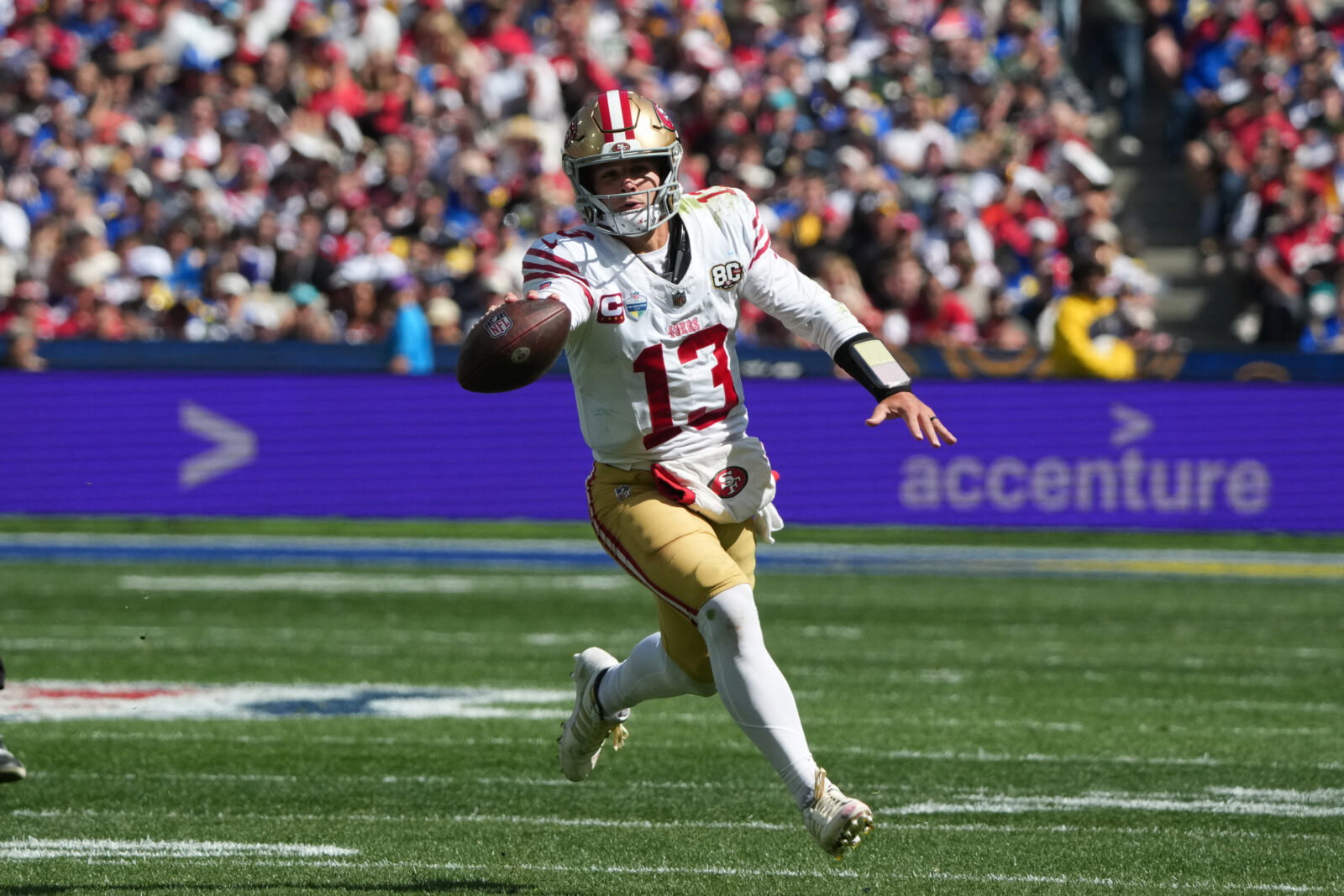 Sep 11, 2026; Melbourne, Victoria, Australia; San Francisco 49ers quarterback Brock Purdy (13) runs with the ball in the second half against the Los Angeles Rams during the 2026 NFL Melbourne Game at Melbourne Cricket Ground. Mandatory Credit: Kirby Lee-Imagn Images