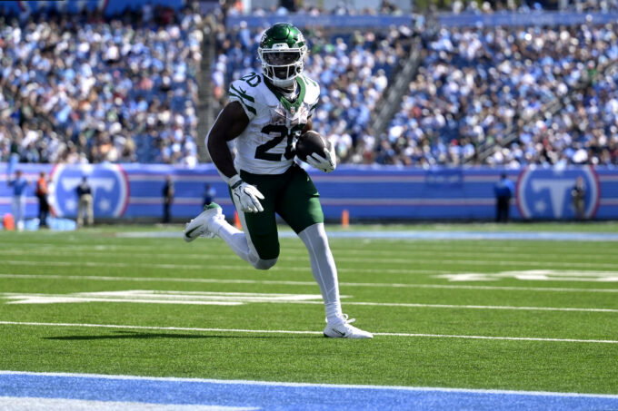 Sep 13, 2026; Nashville, Tennessee, USA; New York Jets running back Breece Hall (20) runs with the ball for a touchdown against the Tennessee Titans during the third quarter at Nissan Stadium. Mandatory Credit: Steve Roberts-Imagn Images