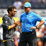 Sep 13, 2026; Inglewood, California, USA; Los Angeles Chargers head coach Jim Harbaugh stands on the field with offensive coordinator Mike McDaniel prior to a game against the Arizona Cardinals at SoFi Stadium.at SoFi Stadium. Mandatory Credit: William Liang-Imagn Images