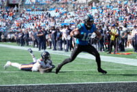 Sep 13, 2026; Charlotte, North Carolina, USA; Carolina Panthers wide receiver Jalen Coker (18) runs the ball for a touchdown in the fourth quarter against the Chicago Bears at Bank of America Stadium. Mandatory Credit: Jim Dedmon-Imagn Images