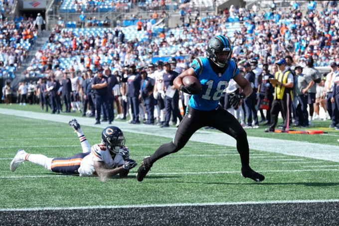 Sep 13, 2026; Charlotte, North Carolina, USA; Carolina Panthers wide receiver Jalen Coker (18) runs the ball for a touchdown in the fourth quarter against the Chicago Bears at Bank of America Stadium. Mandatory Credit: Jim Dedmon-Imagn Images