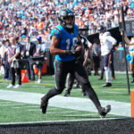 Sep 13, 2026; Charlotte, North Carolina, USA; Carolina Panthers wide receiver Jalen Coker (18) scores a touchdown in the second half against the Chicago Bears at Bank of America Stadium. Mandatory Credit: Jim Dedmon-Imagn Images