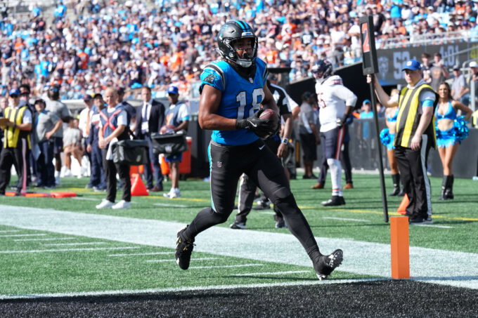 Sep 13, 2026; Charlotte, North Carolina, USA; Carolina Panthers wide receiver Jalen Coker (18) scores a touchdown in the second half against the Chicago Bears at Bank of America Stadium. Mandatory Credit: Jim Dedmon-Imagn Images