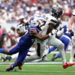 Sep 13, 2026; Houston, Texas, USA; Houston Texans wide receiver Nico Collins (12) runs with the ball after a catch against Buffalo Bills cornerback Christian Benford (47) during the fourth quarter at Reliant Stadium. Mandatory Credit: Troy Taormina-Imagn Images
