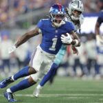 Sep 13, 2026; East Rutherford, New Jersey, USA; New York Giants wide receiver Malik Nabers (1) carries the ball against the Dallas Cowboys during the third quarter at MetLife Stadium. Mandatory Credit: Brad Penner-Imagn Images