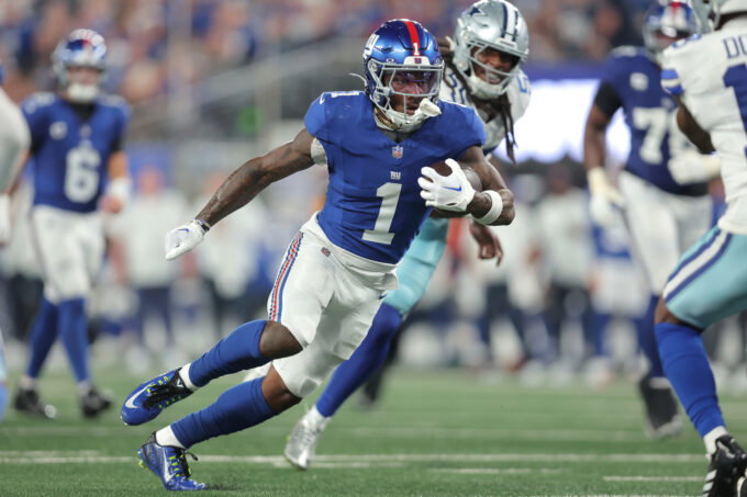 Sep 13, 2026; East Rutherford, New Jersey, USA; New York Giants wide receiver Malik Nabers (1) carries the ball against the Dallas Cowboys during the third quarter at MetLife Stadium. Mandatory Credit: Brad Penner-Imagn Images