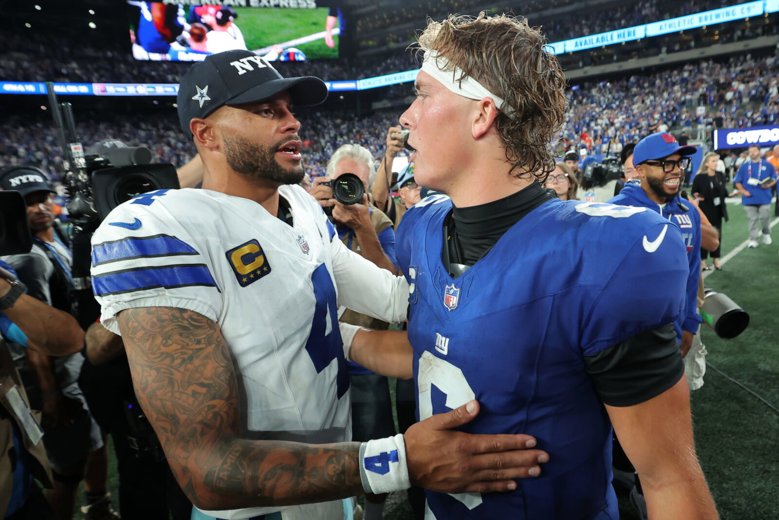 Sep 13, 2026; East Rutherford, New Jersey, USA; Dallas Cowboys quarterback Dak Prescott (4) speaks with New York Giants quarterback Jaxson Dart (6) after the game at MetLife Stadium. Mandatory Credit: Brad Penner-Imagn Images