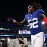 Sep 13, 2026; East Rutherford, New Jersey, USA; New York Giants linebacker Arvell Reese (52) celebrates as he leaves the field following a win against the Dallas Cowboys in the game at MetLife Stadium. Mandatory Credit: Vincent Carchietta-Imagn Images