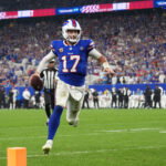 Sep 17, 2026; Orchard Park, New York, USA; Buffalo Bills quarterback Josh Allen (17) runs to score a touchdown against the Detroit Lions during the second half at New Highmark Stadium. Mandatory Credit: Gregory Fisher-Imagn Images
