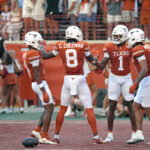 Sep 19, 2026; Austin, Texas, USA; Texas Longhorns wide receiver Cam Coleman (8) celebrates with wide receiver Ryan Wingo (1) and teammates after scoring a touchdown during the first half against the UTSA Roadrunners at Darrell K Royal-Texas Memorial Stadium. Mandatory Credit: Scott Wachter-Imagn Images