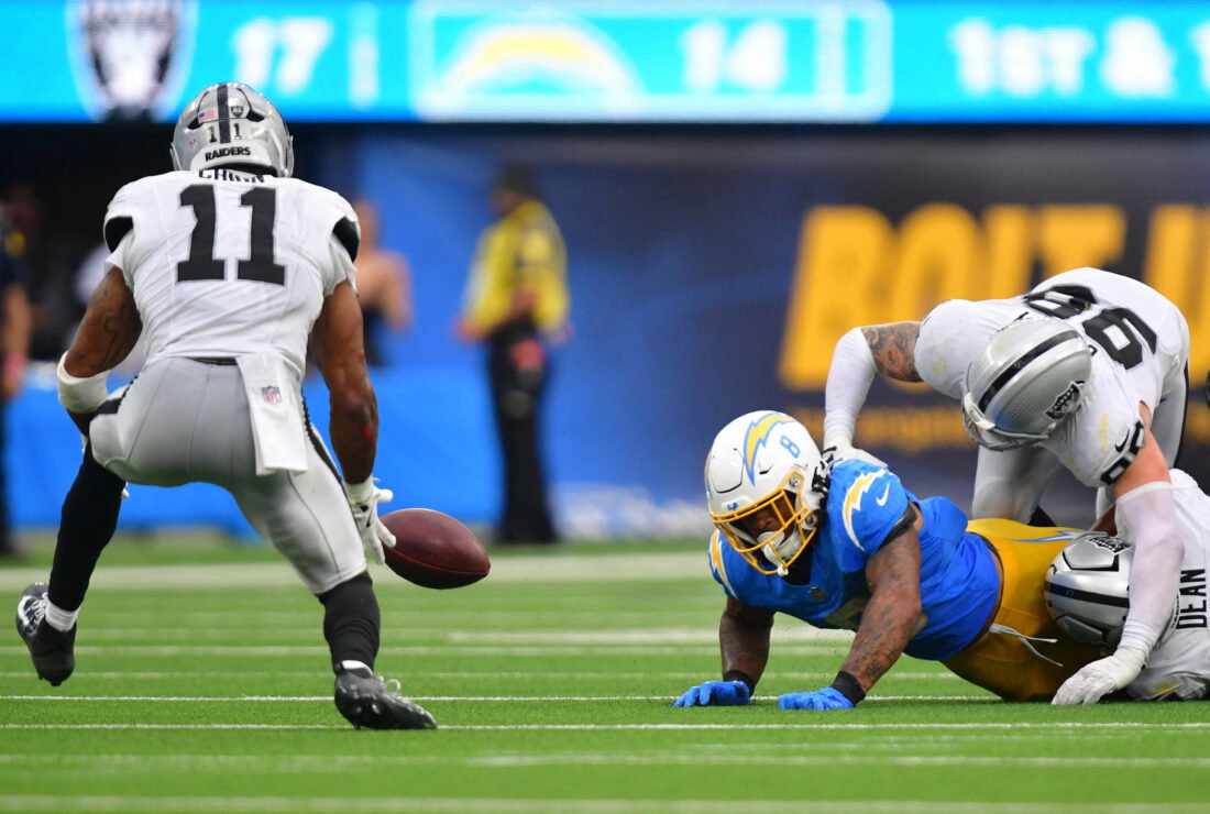 Sep 20, 2026; Inglewood, California, USA; Las Vegas Raiders safety Jeremy Chinn (11) recovers a fumble against the Los Angeles Chargers during the second half at SoFi Stadium. Mandatory Credit: Gary A. Vasquez-Imagn Images